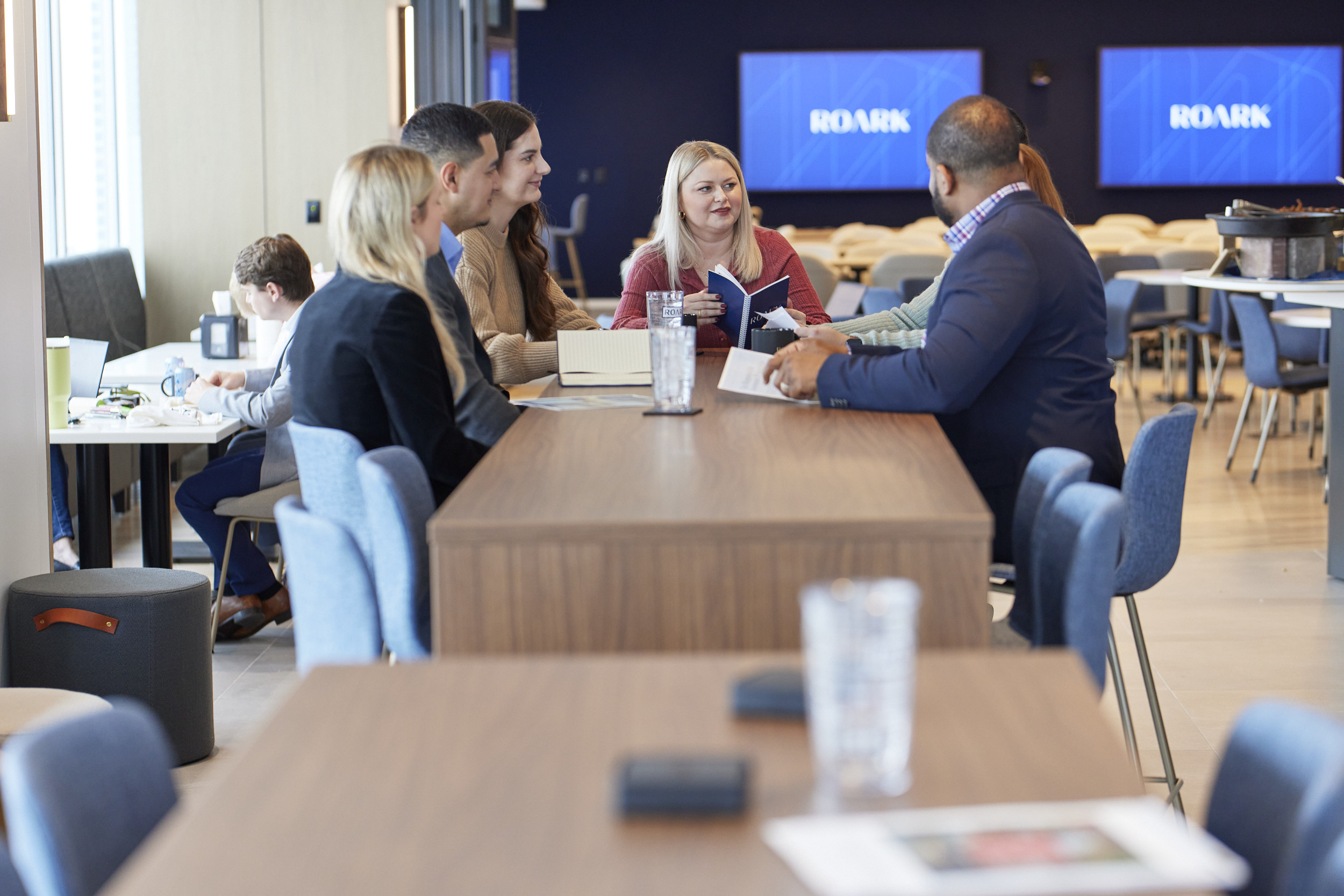 Team Member Meeting Around Table