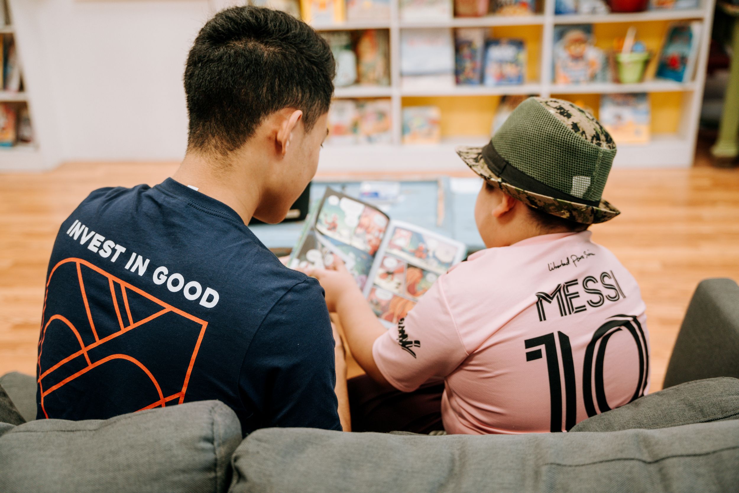 Man and Boy Reading Book
