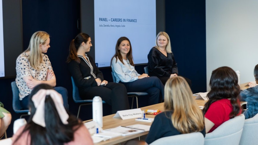 4 Women on Panel Presenting to Audience